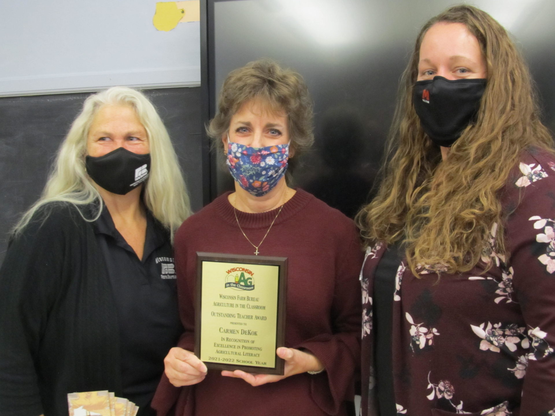 Carmen DeKok (center) was with Wisconsin Farm Bureau’s Ag in the Classroom program’s Outstanding Teacher of the Year Award by Rock County Ag in the Classroom Committee members Sheila Everhart (left) and Stacy Skemp (right).